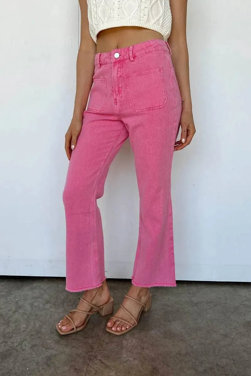 Get Your Fashion Fix: Pink Flare Leg Jeans with Raw Hem